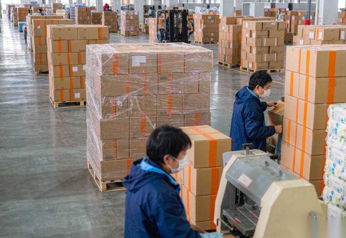 Jinman Paper Supplies shipping area with export cartons stacked on pallets